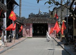 Japanese bridge  Girl passing over in front of the Japanese Bridge, Hoi An, VIetnam